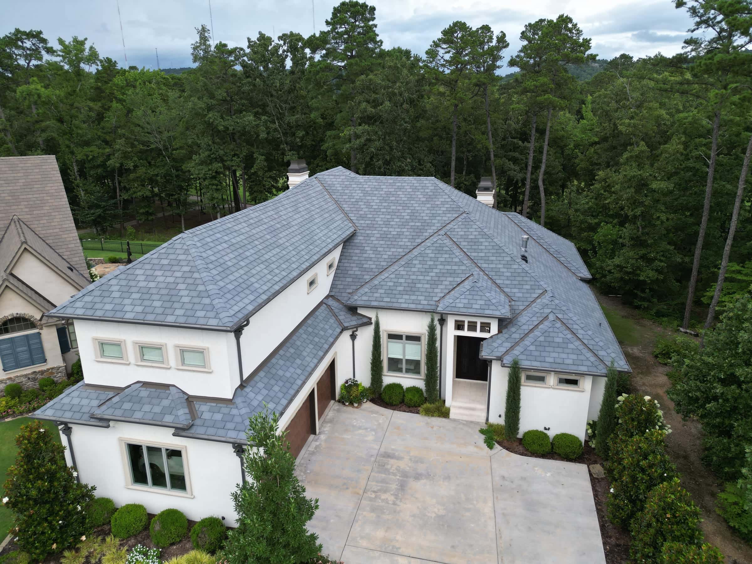 White two-story home with a new gray architectural asphalt shingle roof