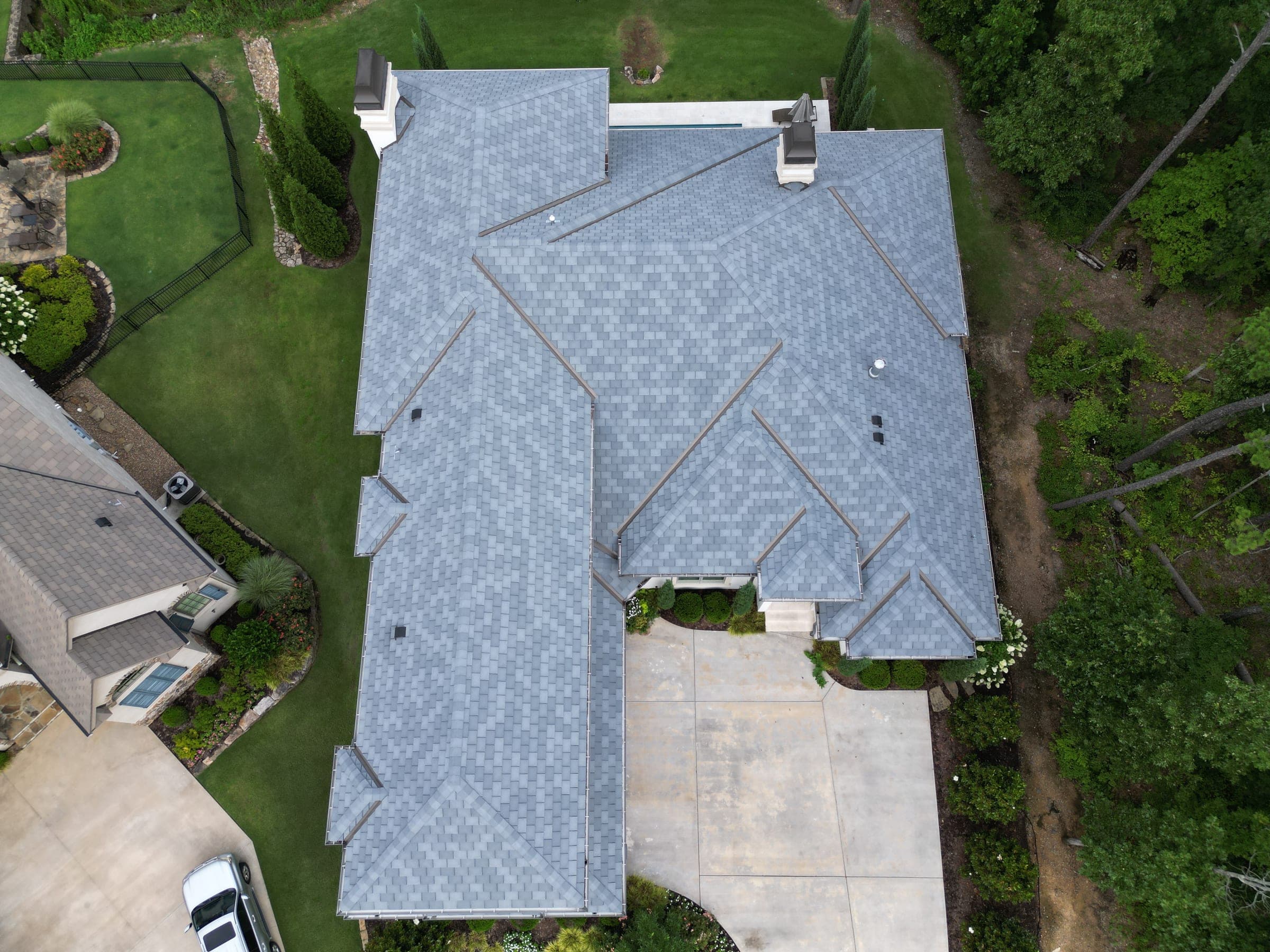 Top-down aerial of a complex architectural shingle roof